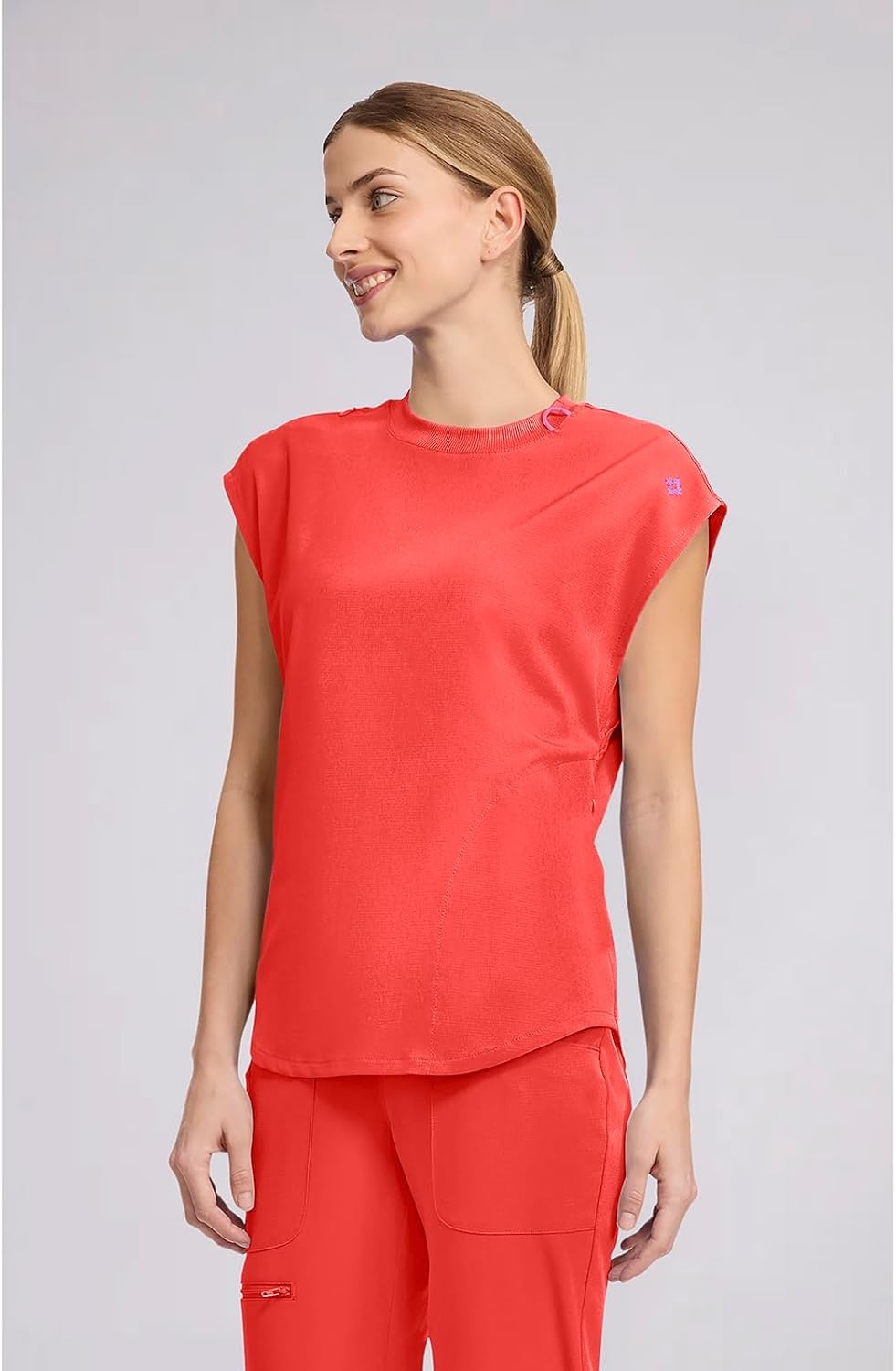 image:imageMed Couture AMP Womens Scrub Tops Round Neck Tuckable 2 Zipper PocketOne in a Melon